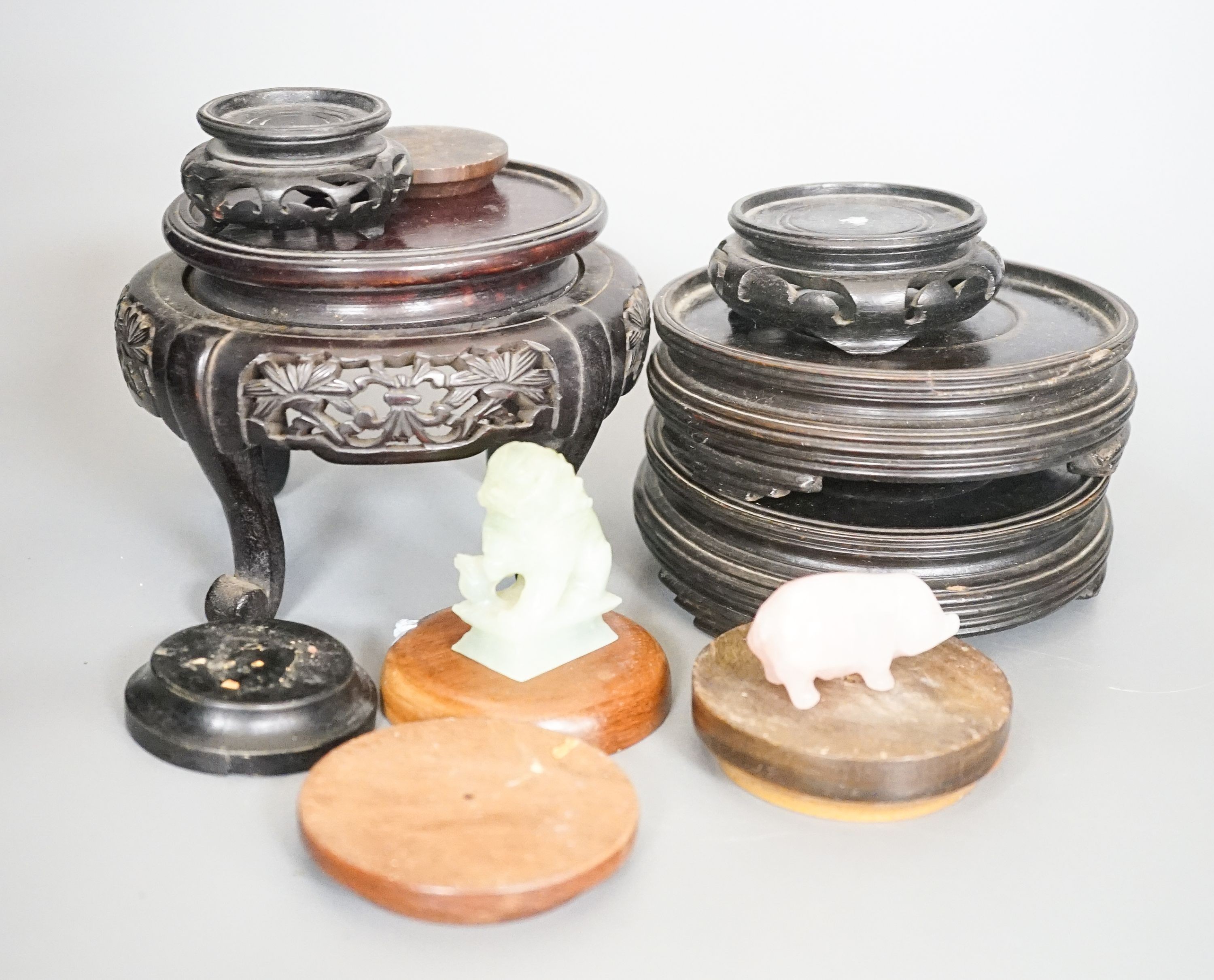 A group of Chinese wooden stands and stone carvings etc